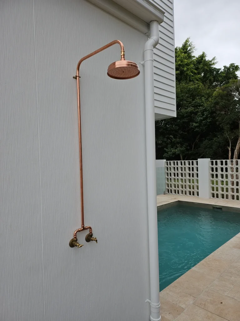 new poolside copper outdoor shower