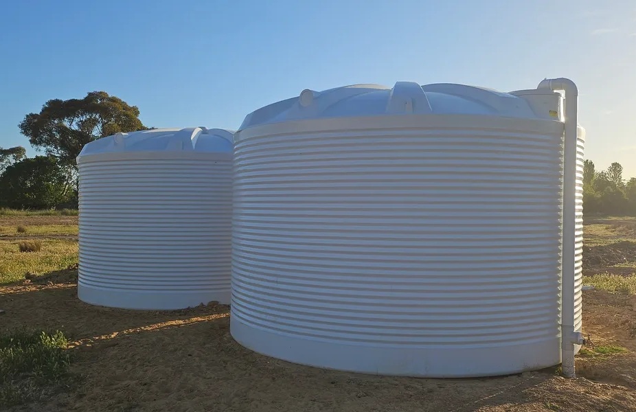 Installing two 30,000-litre rainwater tanks on a rural property with no mains water supply provides a reliable and self-sufficient water source for the home and land. These tanks are connected to a charged stormwater system, which efficiently collects and stores rainwater from rooftops, ensuring maximum water capture even during heavy rainfall. The large storage capacity supports household needs and irrigation, reducing reliance on external water deliveries. With proper filtration and pumping systems, the stored water remains clean and safe for use. This setup offers a sustainable, cost-effective, and long-term water solution, ensuring year-round supply in a remote location.